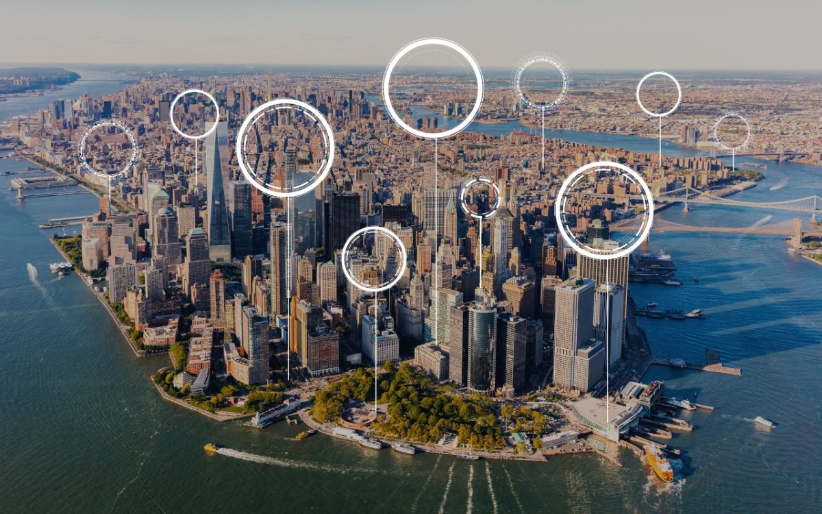 an aerial view of New York city using various sizes of circular hologram objects at various locations